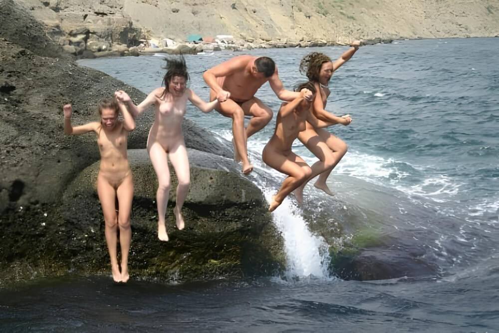 Mens and girls nudists on a beach - Naturism and nudism as a path to inner freedom, harmony, and acceptance