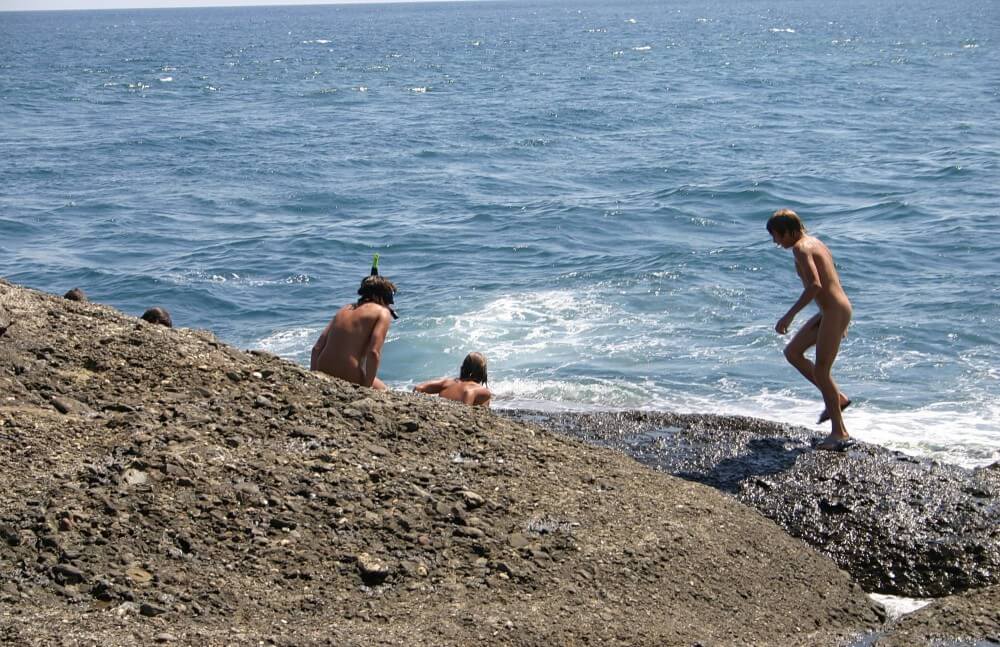 Leaning Against Hit Rocks pics - Nudism is normal and fun